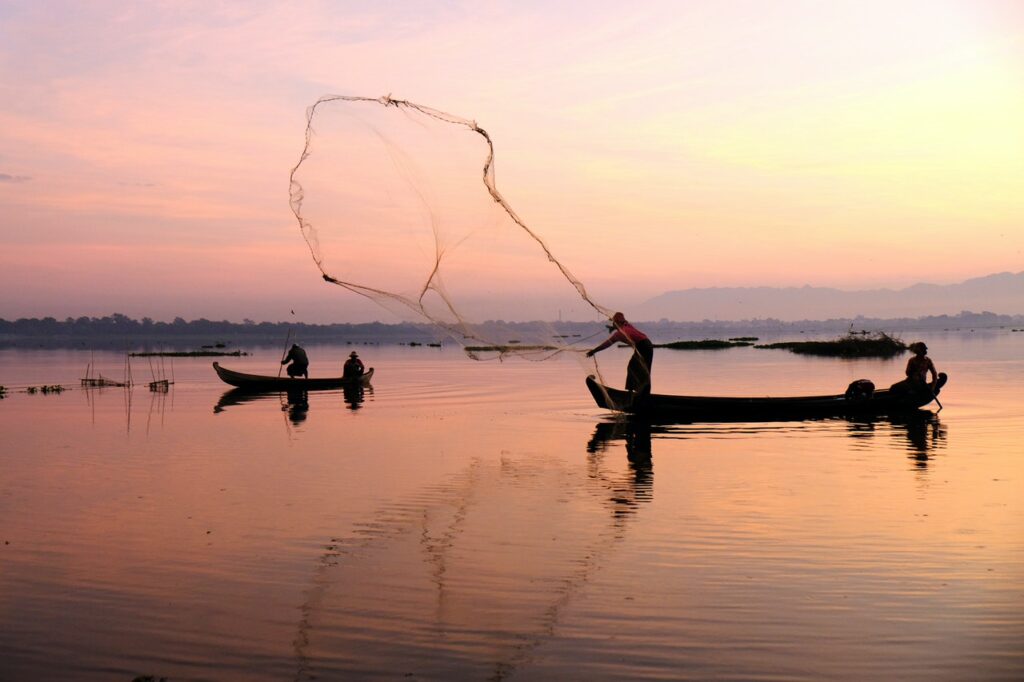 Fishermen throwing a net